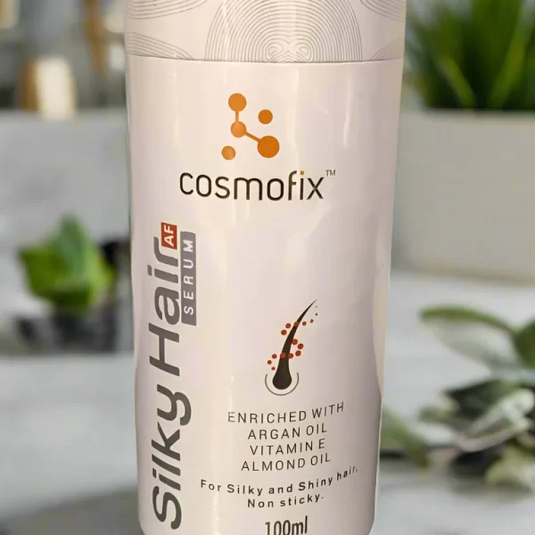 Cosmofix SilkyHair AF Hair Serum is a lightweight, non-greasy serum enriched with Argan Oil, Grapeseed Oil, and Tender Coconut Oil to control frizz, smooth flyaways, and add instant shine. With added UV protection, it keeps your hair soft, glossy, and protected all day.